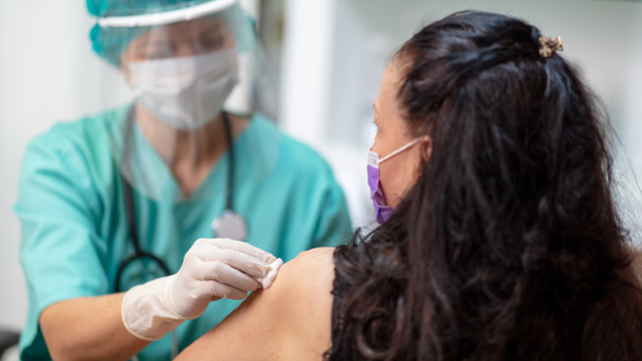 WOman receiving a vaccination