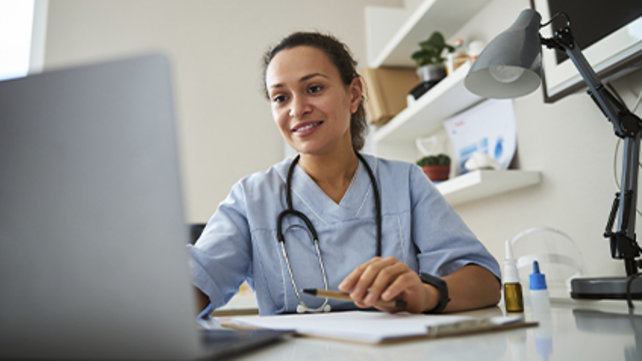 Woman researcher looking at her computer