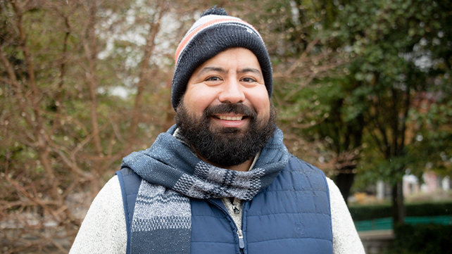 A man stands in a park.