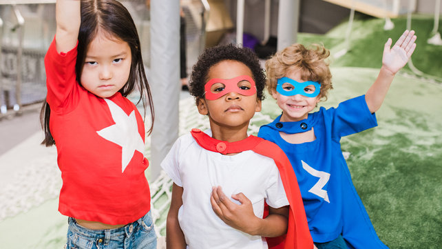 Young kids in super hero costumes.