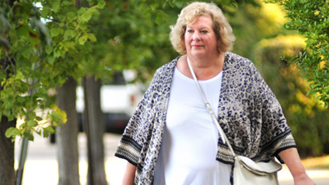 Karen Holt walking outside.