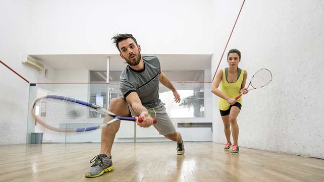Adults playing Racket Ball