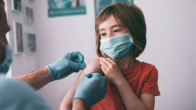 Young child receiving an immunization