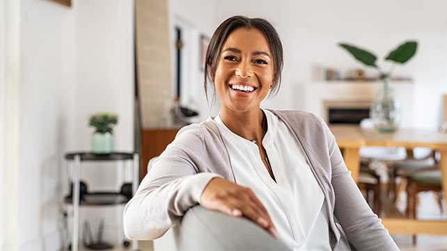 Smiling woman sitting in a chair
