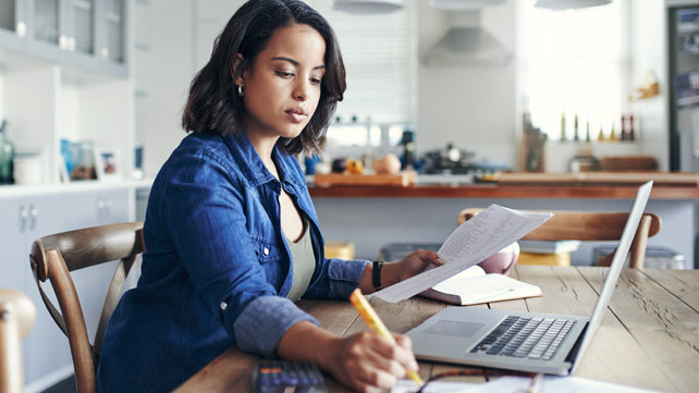 Adult looking at a laptop