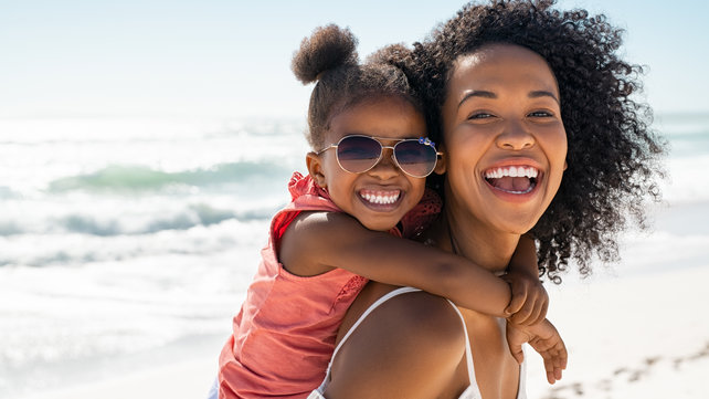 woman-daughter-beach