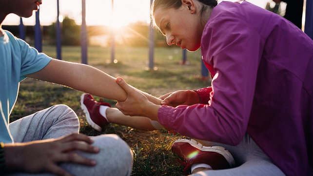 Mom checking son's injury
