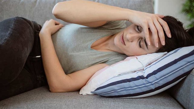Women suffering a migraine