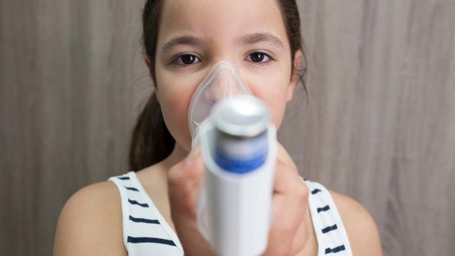 Child with asthma inhaler
