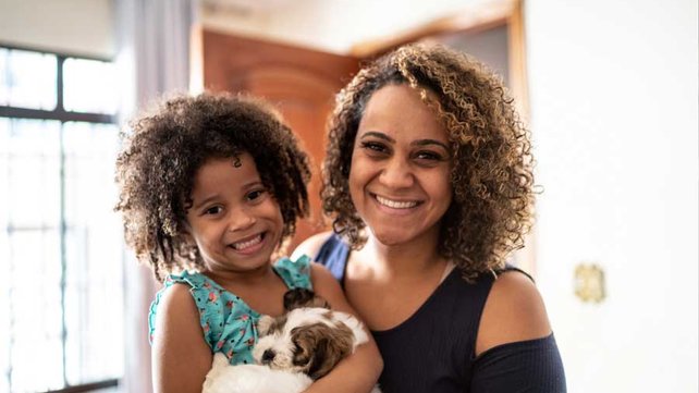 Mother and daughter smiling