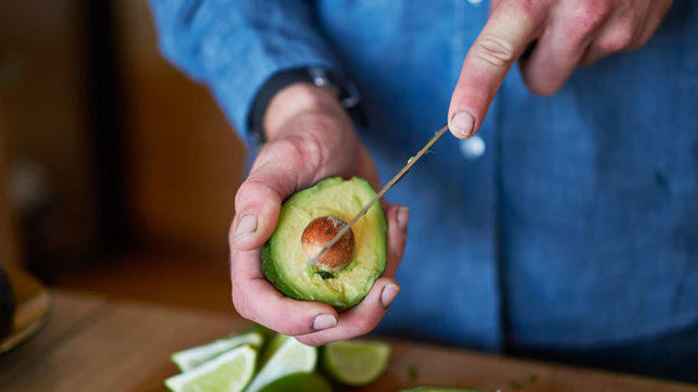 Man cutting avocado