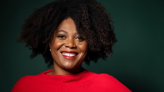 African American woman wearing a red sweater