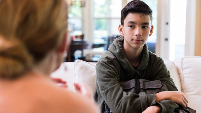 A teen in a session with a counselor.