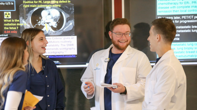 Students and faculty talk at Lifespan School of Medical Imaging