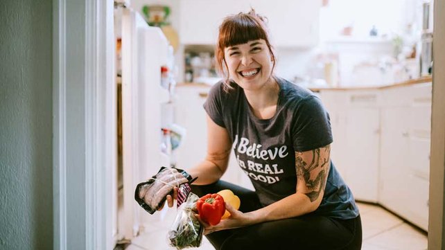 Women getting food from refrigerator