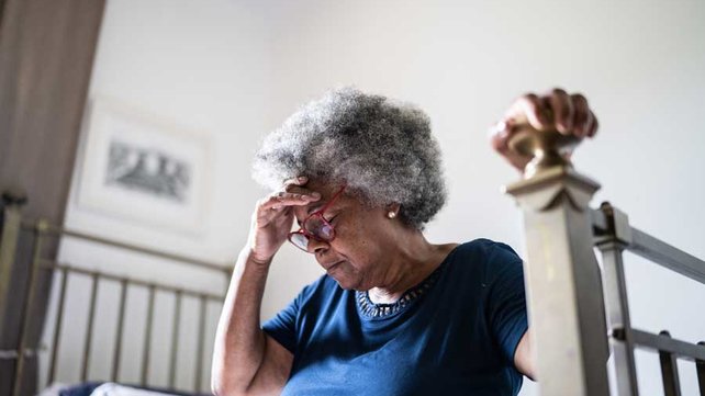 Women feeling sick on bed