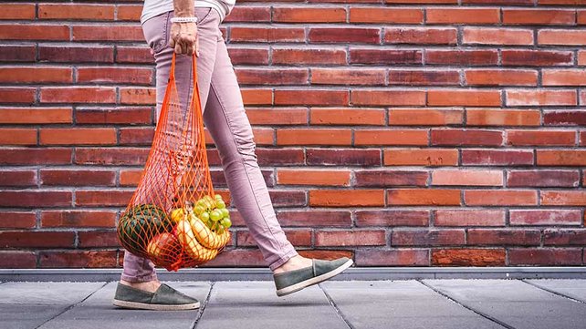 Women walking with fresh fruit and vegetables