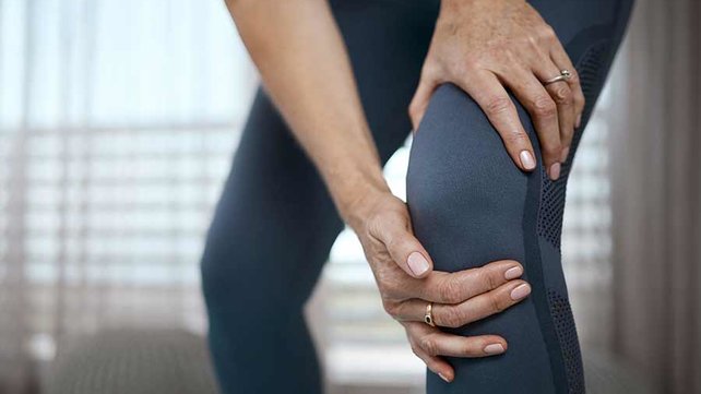 Women holding knee after exercise
