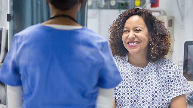 A woman about to have a breast exam