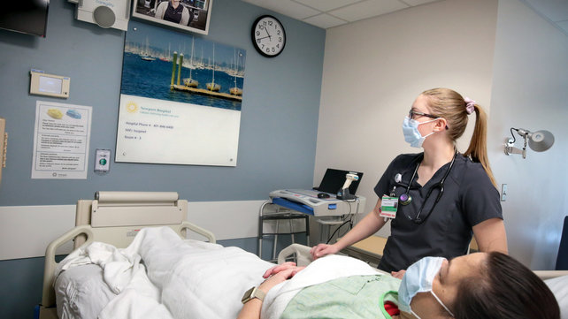 A nurse working with a patient at Newport Hospital
