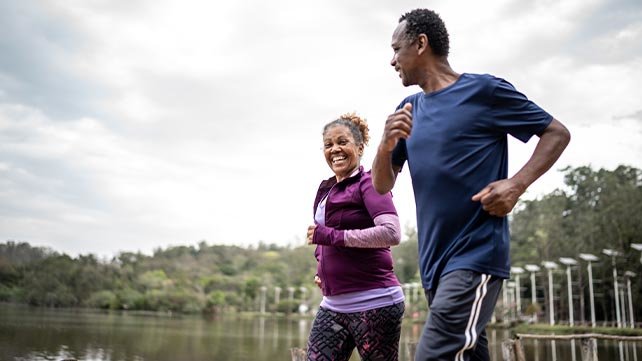 Senior couple jogging in a park