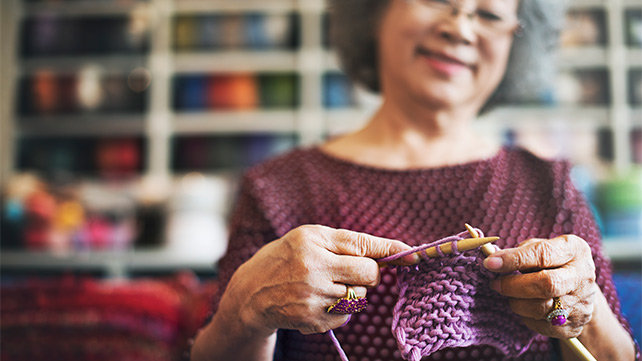 Older woman knitting