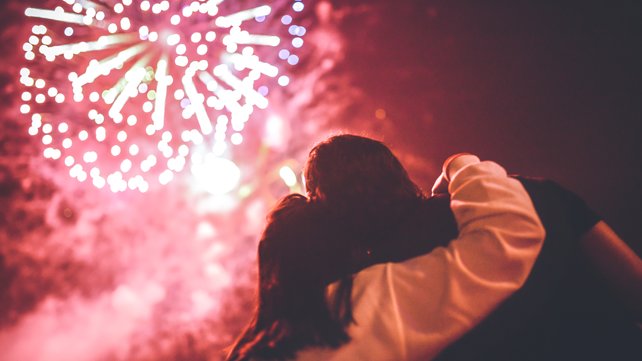 two people watching a professional firework display