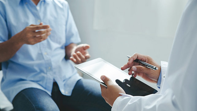 A patient talks with a doctor.
