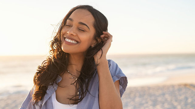 young-woman-smiling-beach