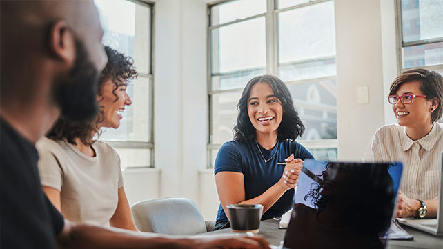 People working around a desk