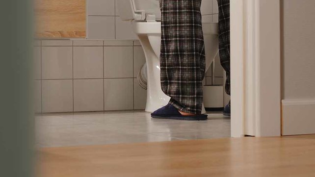 Man going to bathroom