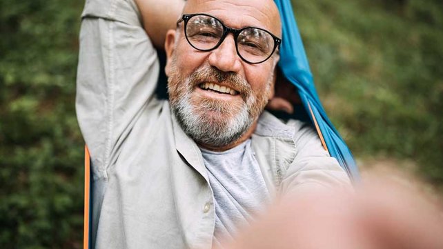 Man in hammock smiling