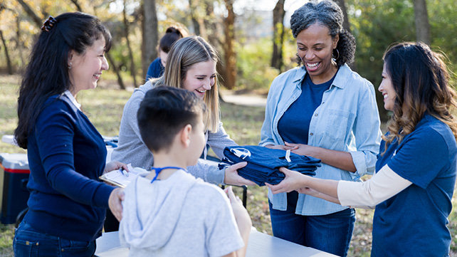 T-shirt distribution at an outside community event