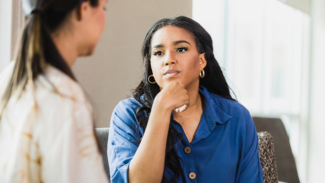 Female practitioner speaking with a female patient
