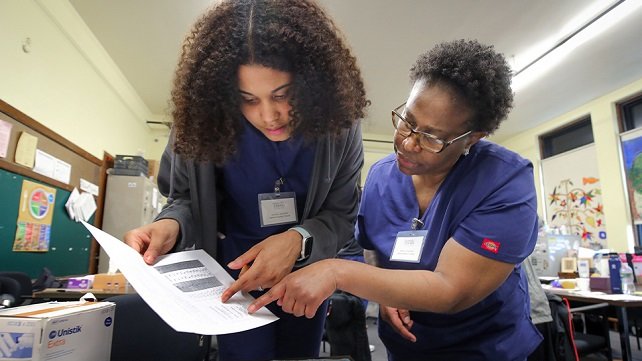 A student participating in the medical assistant training program
