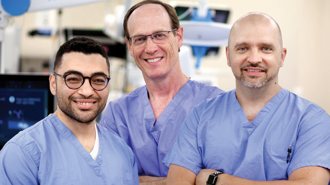 three doctors operating room