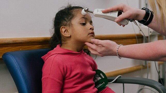 Yung child receiving a medical check-up