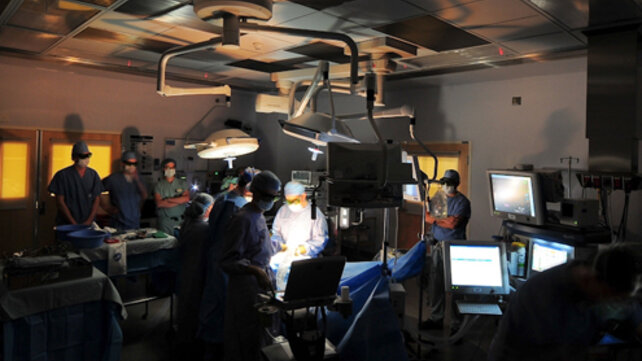 A group of clinicians in an operating room