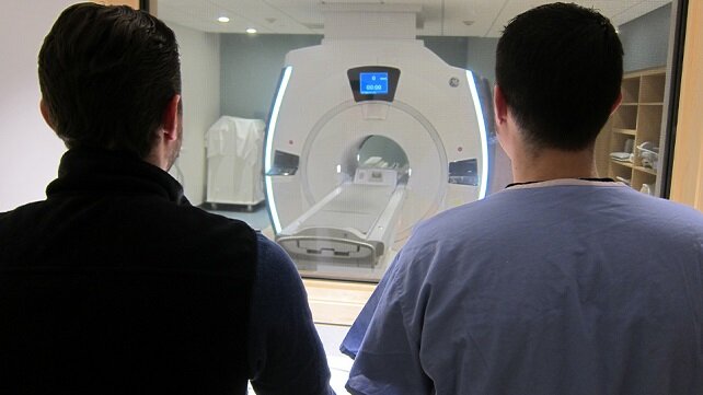 Imaging staff at Morton Hospital infront of an MRI machine