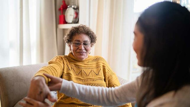 Women with physical therapist at home
