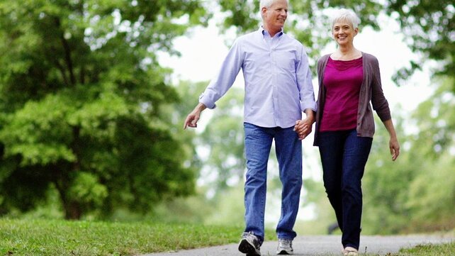 Couple walking in park