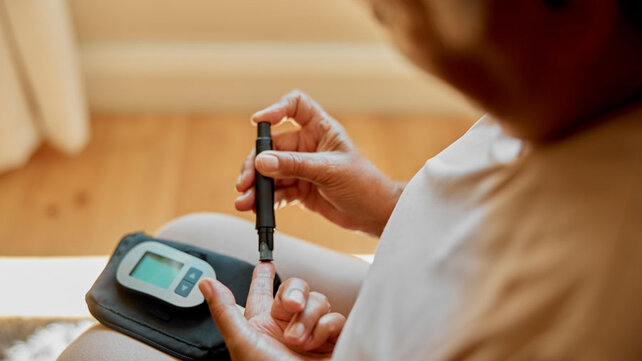 Women testing blood sugar levels