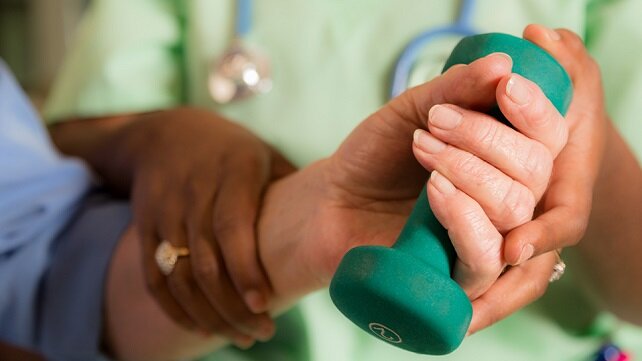 Someone having their hand looked at by a certified hand therapist