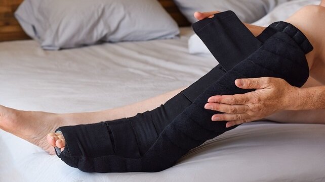 A patient receiving treatment for lymphedema in their leg 