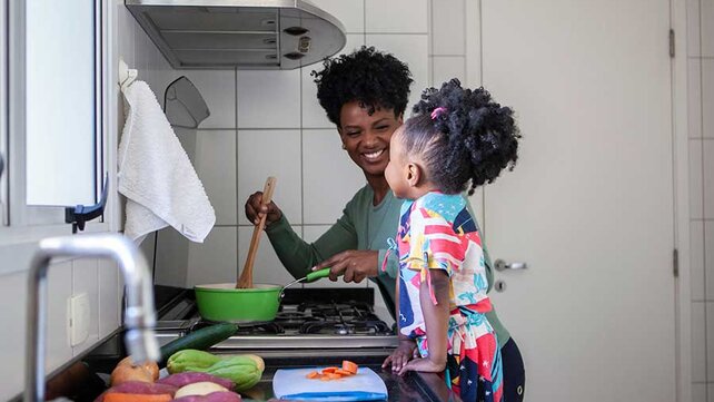 Mother cooking with daughter