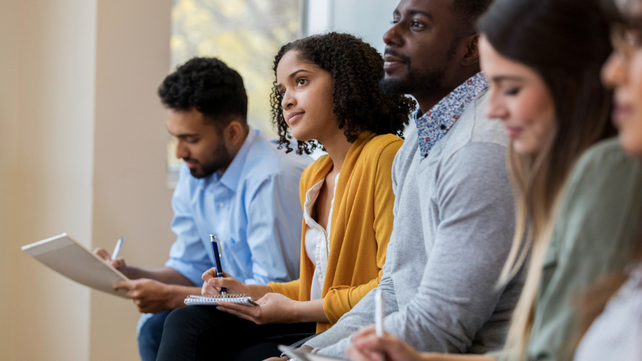 people listenting and writing