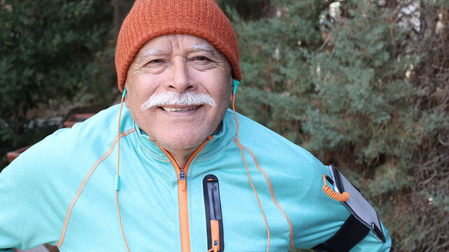 Older man exercising outside in cold