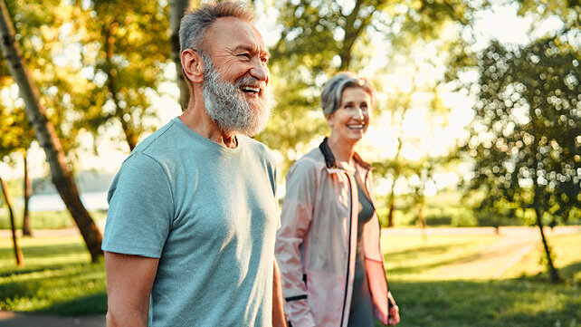 Couple happily walking outside