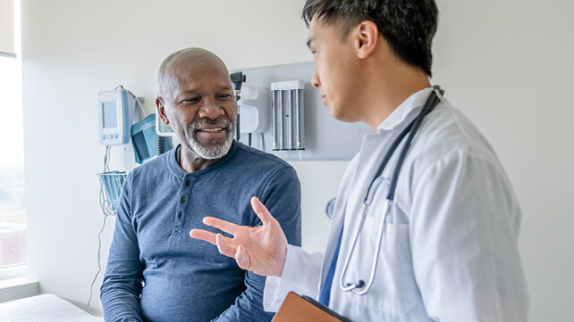 Hernia Patient Holding Stomach for Media Card