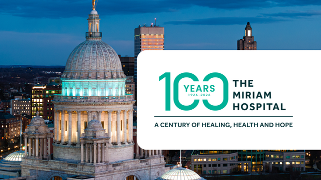 State house celebrating 100 years of The Miriam Hospital with lights